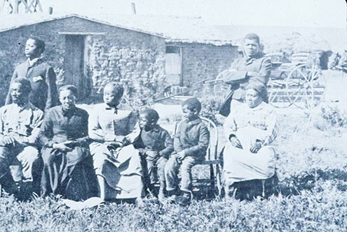 Family in Front of Their House Family in Front of Their House